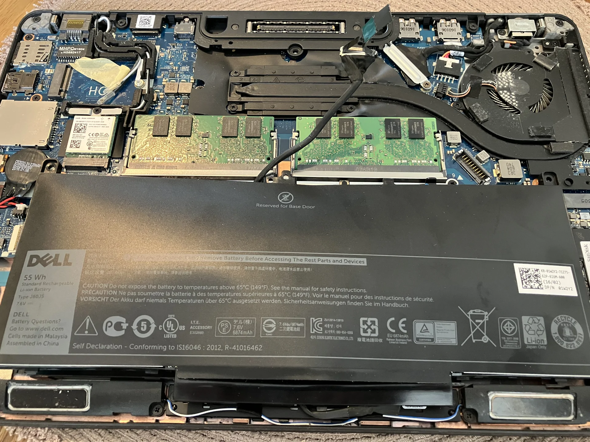 Computer repair technician diagnosing a laptop at PC Fix Express in Leatherhead, Surrey