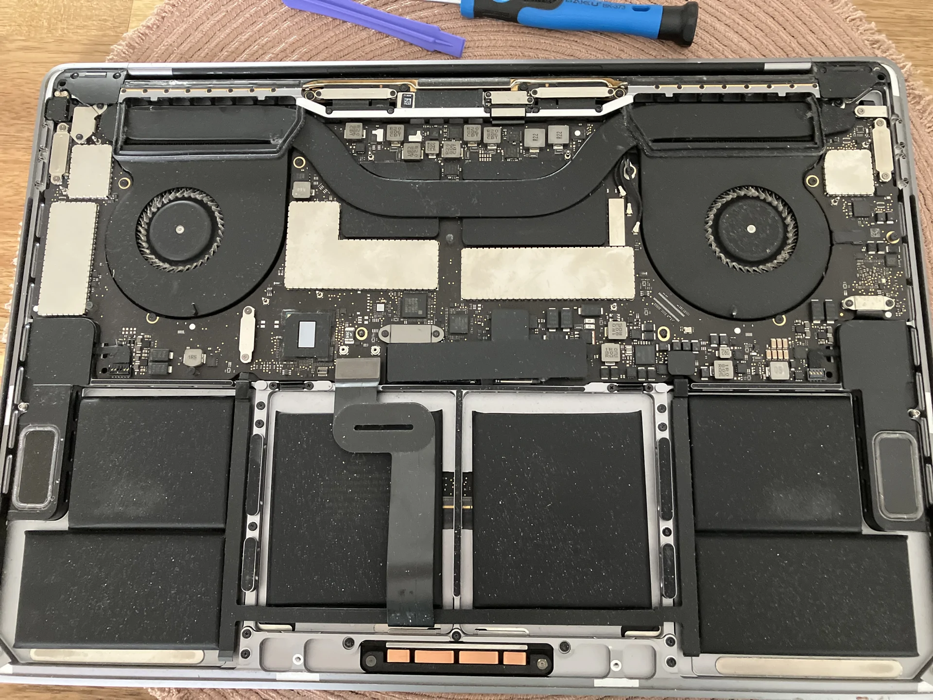 PC Fix Express engineer performing component-level motherboard repair on a desktop PC